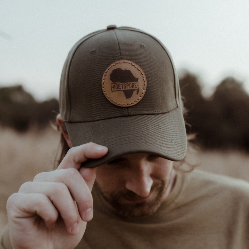 VS Americano Olive Cap worn outdoors